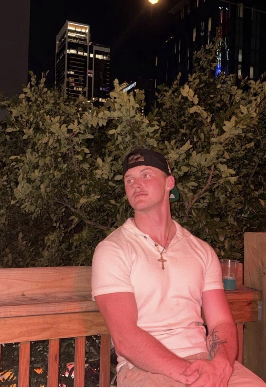 Ethan, who built Ballwise, sitting outside at night